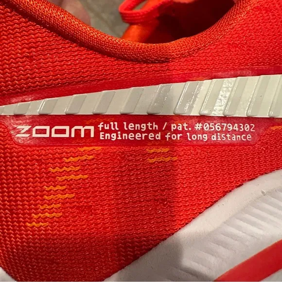 Nike Air Zoom Vomero sneakers, size 15, virtually no wear noted. Orange.