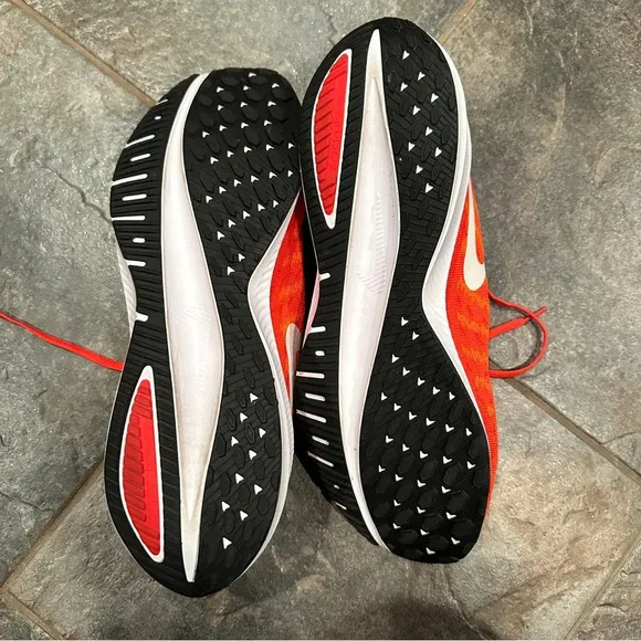Nike Air Zoom Vomero sneakers, size 15, virtually no wear noted. Orange.