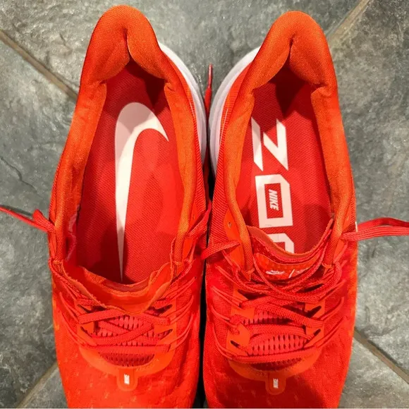 Nike Air Zoom Vomero sneakers, size 15, virtually no wear noted. Orange.