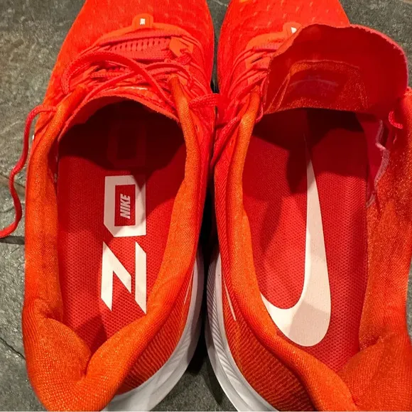 Nike Air Zoom Vomero sneakers, size 15, virtually no wear noted. Orange.