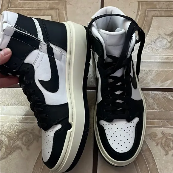 Nike women’s Black and White High-Top Sneakers