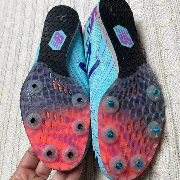 NWOT women’s New Balance Silent Hunter track shoes 9.5 Aqua purple animal print