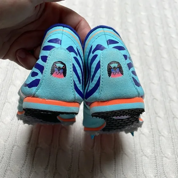 NWOT women’s New Balance Silent Hunter track shoes 9.5 Aqua purple animal print