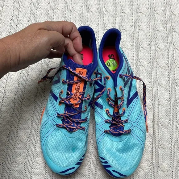 NWOT women’s New Balance Silent Hunter track shoes 9.5 Aqua purple animal print