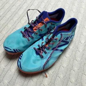 NWOT women’s New Balance Silent Hunter track shoes 9.5 Aqua purple animal print