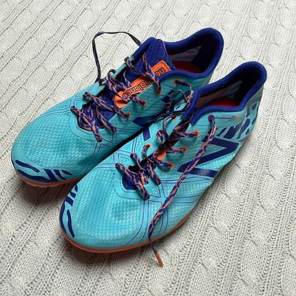 NWOT women’s New Balance Silent Hunter track shoes 9.5 Aqua purple animal print
