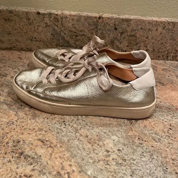 Soludos woman’s gold sparkly tennis shoes