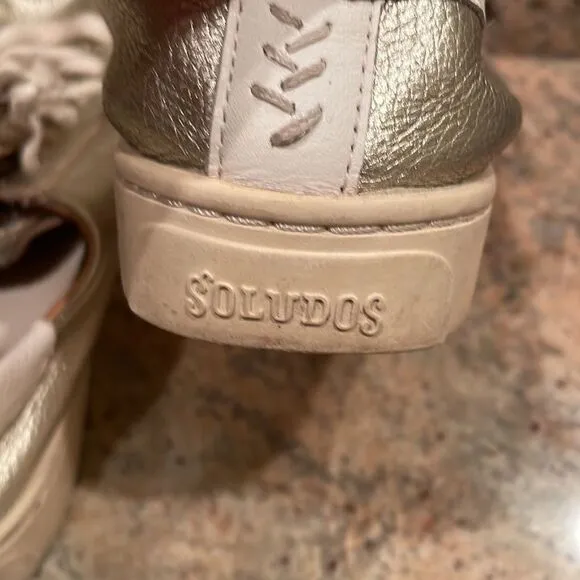 Soludos woman’s gold sparkly tennis shoes