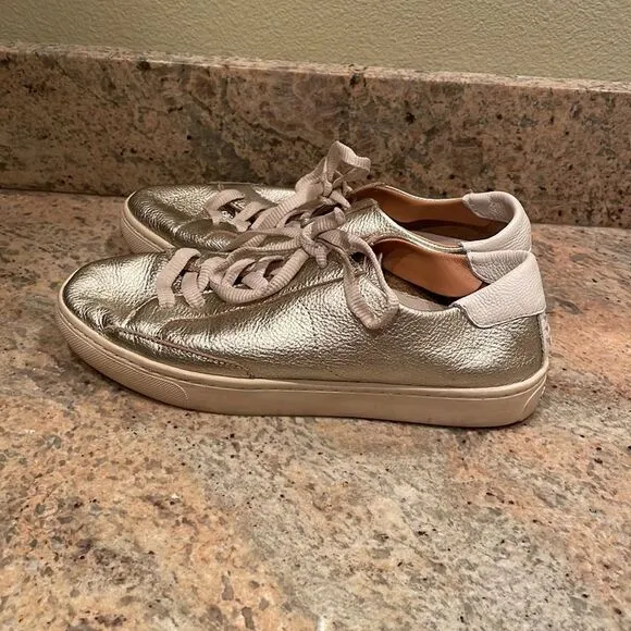 Soludos woman’s gold sparkly tennis shoes