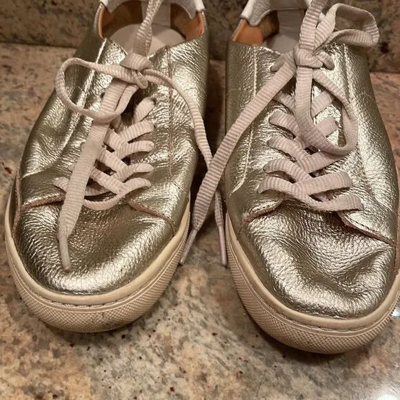 Soludos woman’s gold sparkly tennis shoes