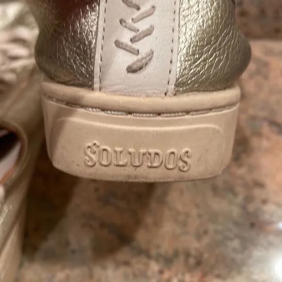 Soludos woman’s gold sparkly tennis shoes